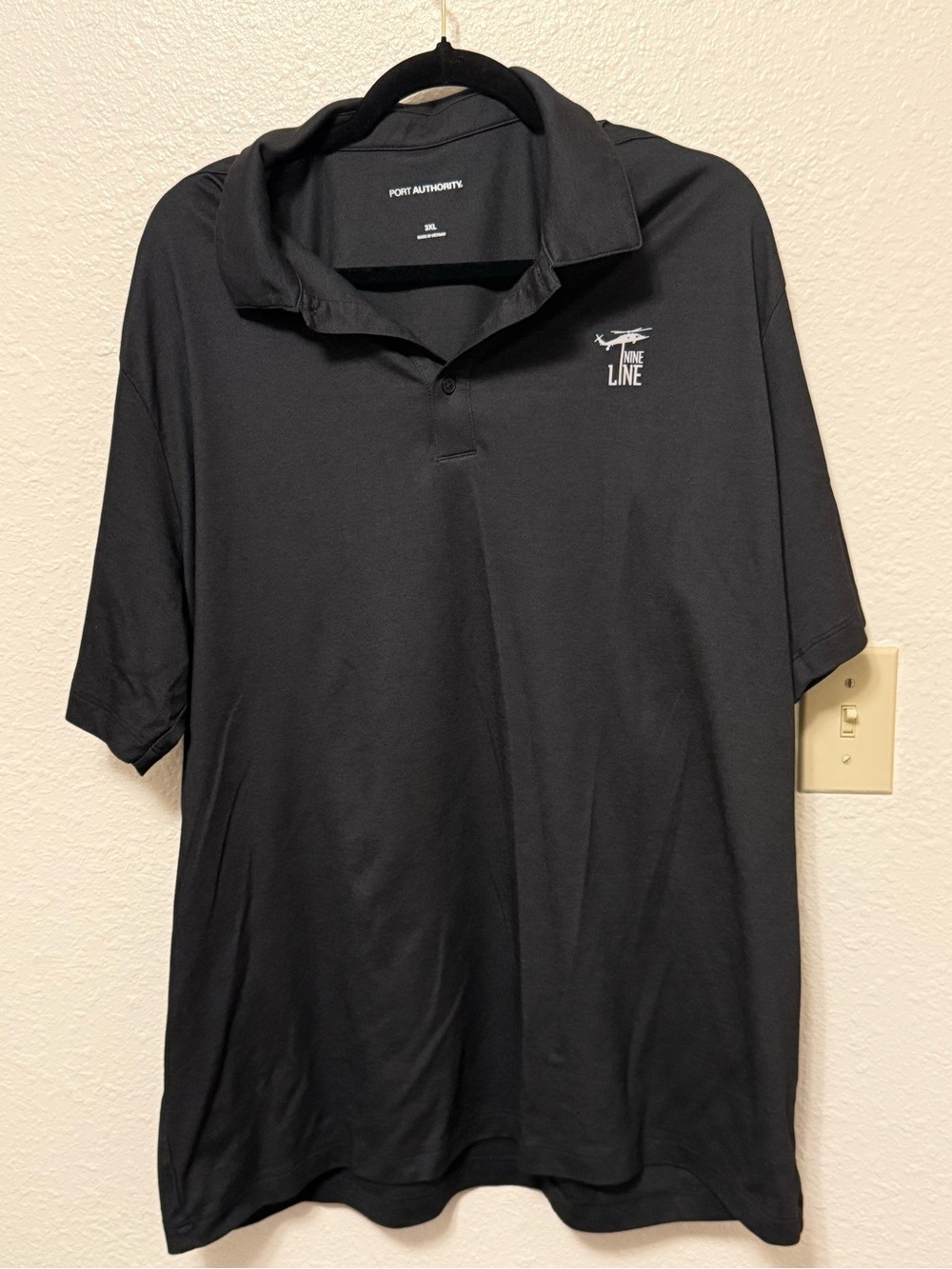 Port Authority Black Polo with Airline Line Embroidery‎